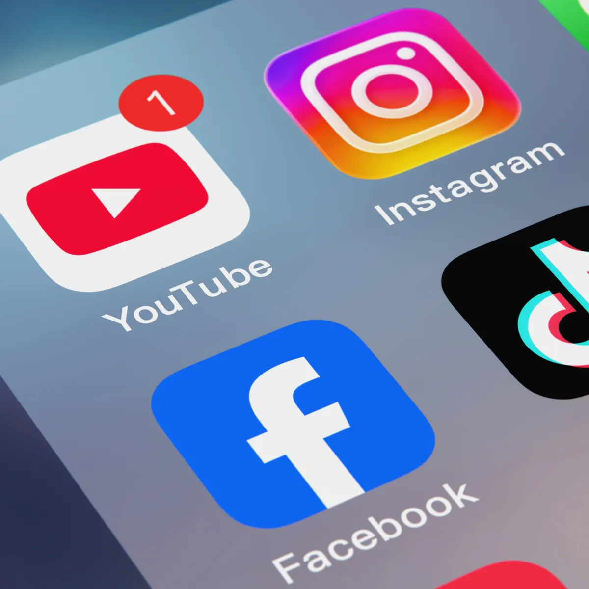 Close up of social media apps on a phone screen where we run client ad campaigns